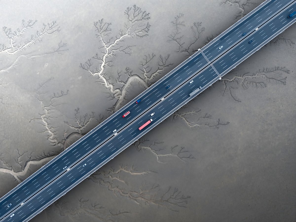 drone photo of a highway crossing a frozen lake