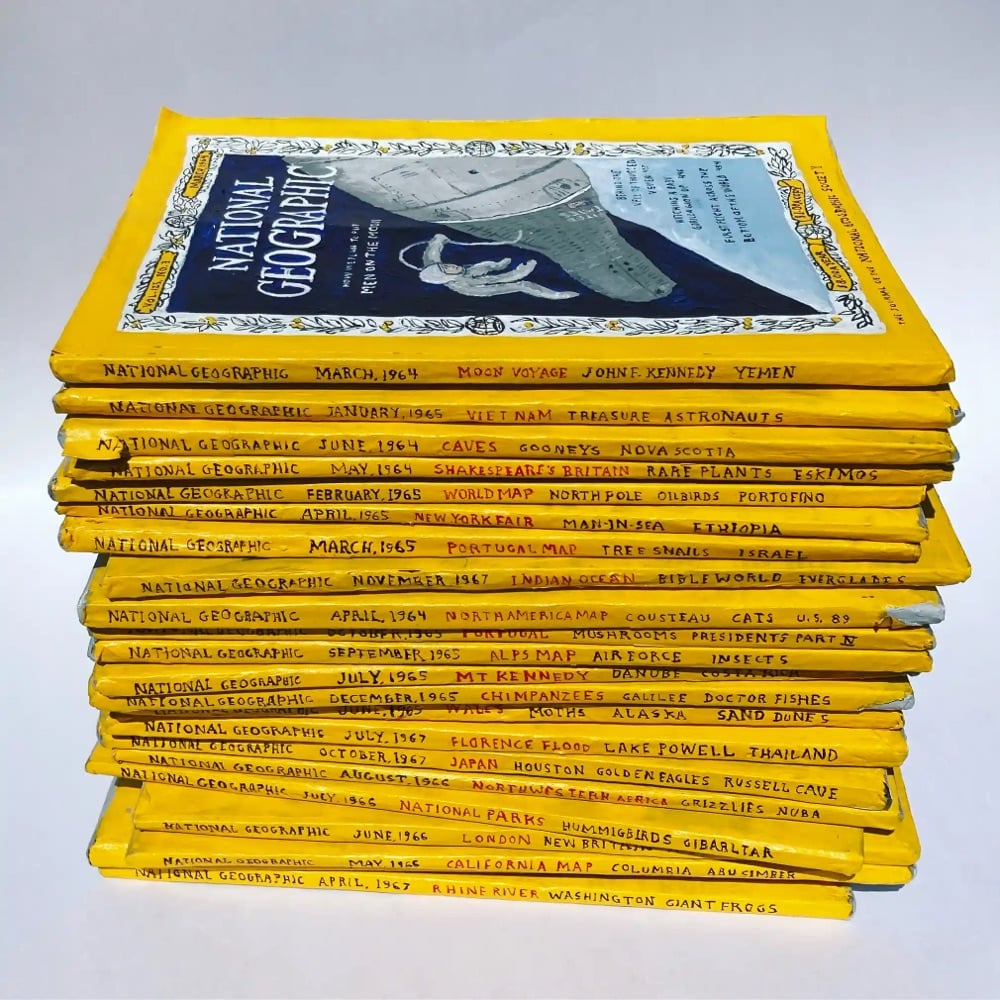 a stack of National Geographic magazines made from paper mâché