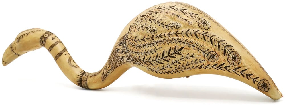 scrimshaw art etched onto a plastic flamingo