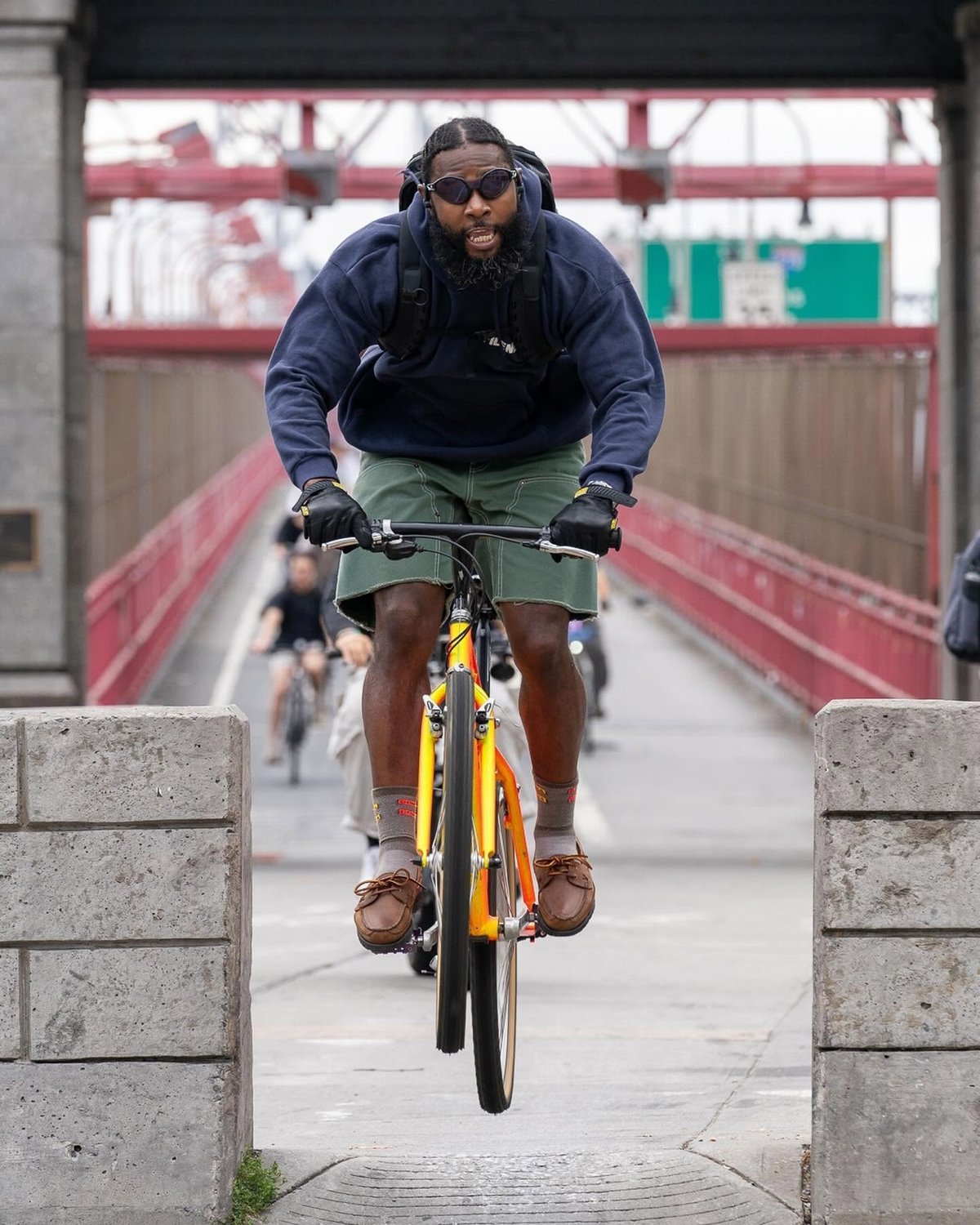 a biker exiting the Williamsburg Bridge bike path